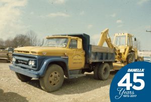 Anniversary Photo - Pictured is our first backhoe