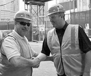 Danella Core Value - Respect (Black and White Image) - Two Employees Shaking Hands