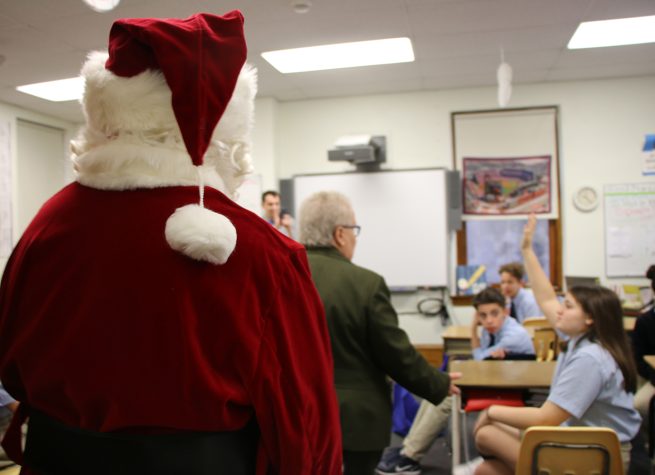 LaSalle - Christmas - Santa entering a classroom with Sr. Jeanne McGowen