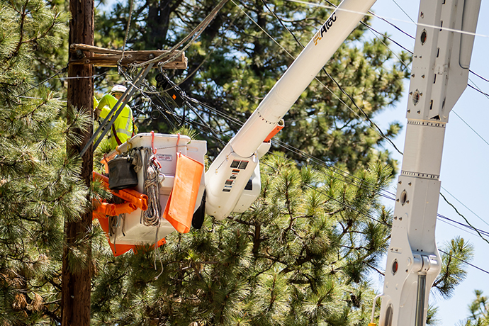 Expansion of services - photo of work crews installing electric cables